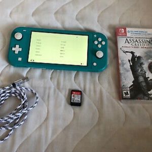 Nintendo switch light blue with 2 games